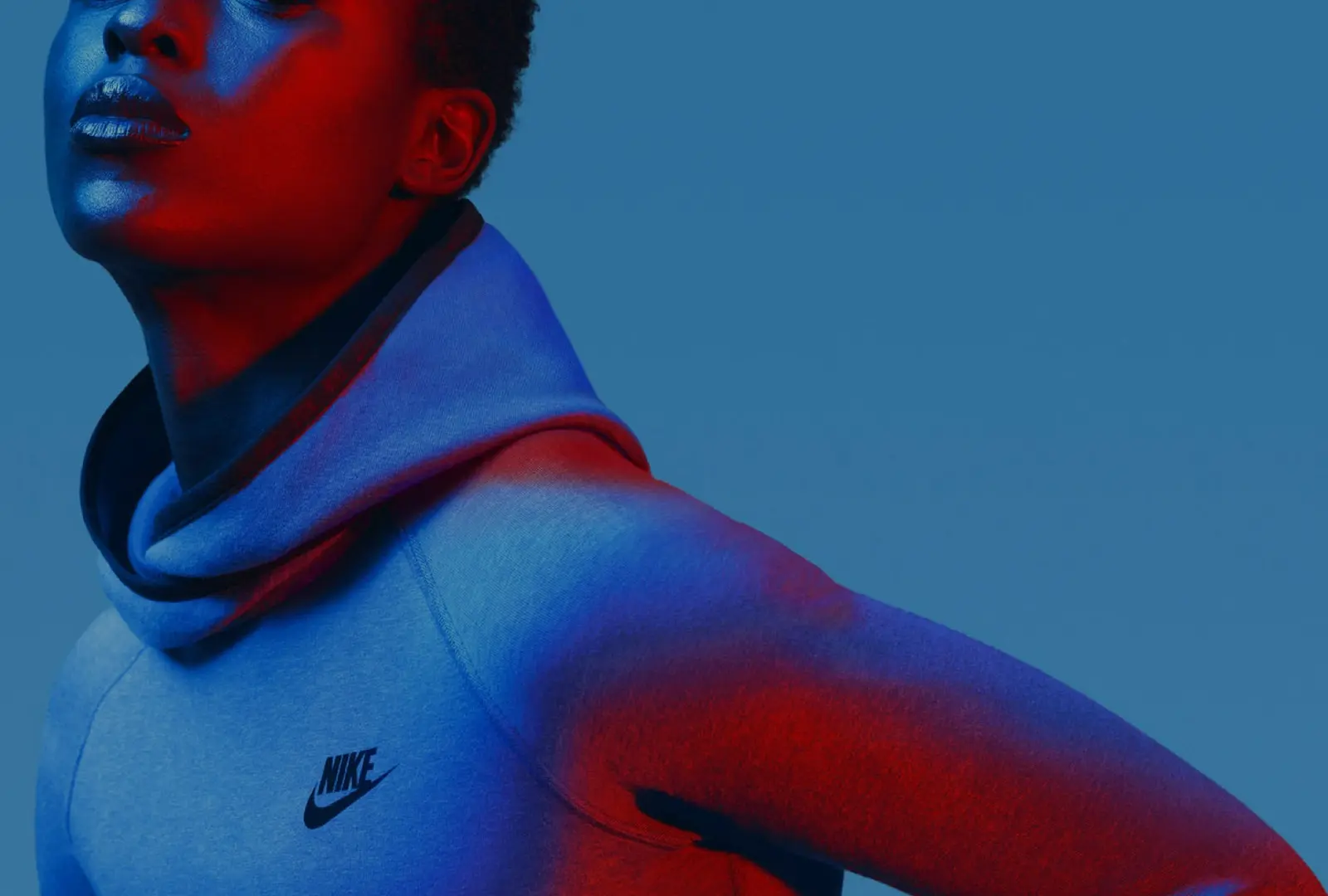 Nike Tech Pack campaign photography: Red-and-blue studio portrait